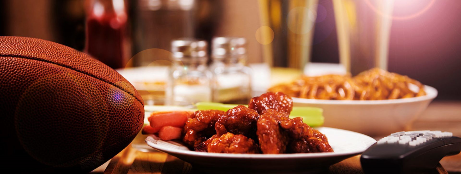 football on table with chicken wings