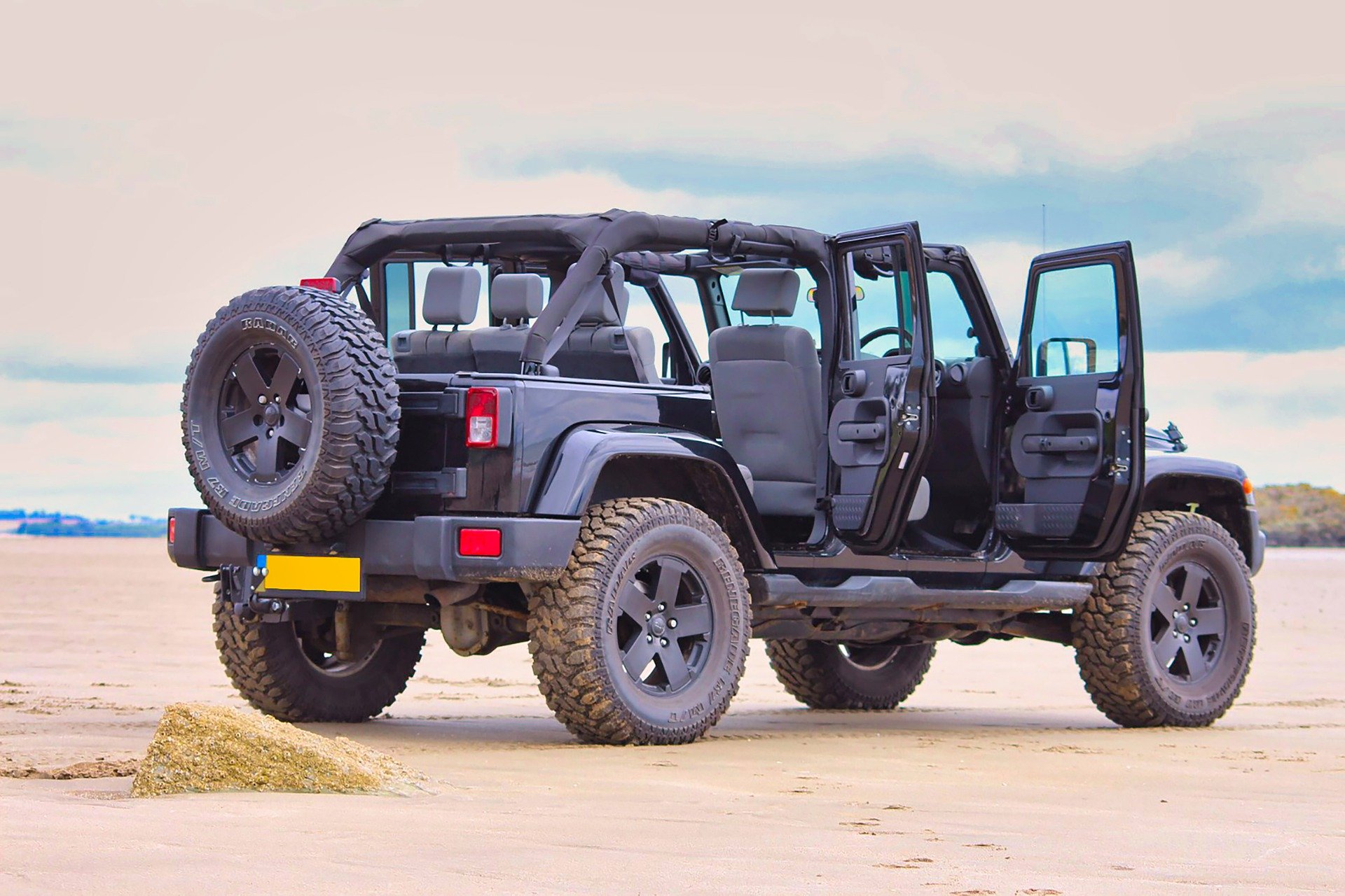 jeep on beach with doors open