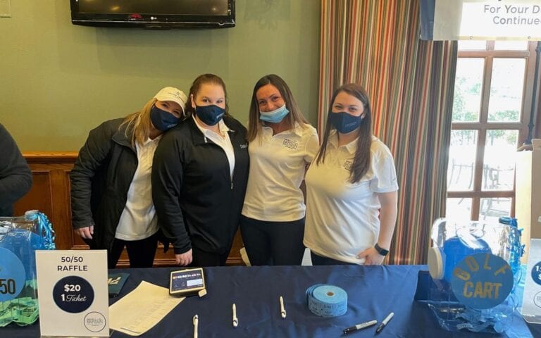 Four Girls at a Golf Raffle Table